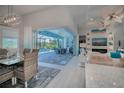 Open concept dining room with pool view and modern light fixture at 10136 Amy Ter, Port Charlotte, FL 33981