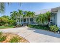 Single-story home with a metal roof and welcoming porch at 200 Capstan Dr, Placida, FL 33946