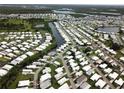 Aerial view of waterfront community with numerous mobile homes at 208 Marlette Dr, North Port, FL 34287