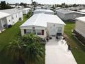Aerial view of a mobile home with surrounding neighborhood visible at 208 Marlette Dr, North Port, FL 34287