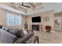 Spacious living room featuring hardwood floors, a ceiling fan, and a flat-screen TV at 191 Brig W Cir, Placida, FL 33946