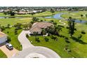 Single-Gathering home on a golf course with a large yard and driveway at 10 Coral Creek Pl, Placida, FL 33946