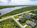 Aerial view of waterfront property with boat access at 15964 Viscount Cir, Port Charlotte, FL 33981