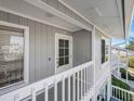 Welcoming entrance with unit number 46, offering a glimpse of the stairs and side view at 6000 Boca Grande Cswy # D46, Boca Grande, FL 33921