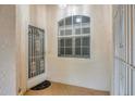 Front entry with decorative door and large window at 2024 Lynx Run, North Port, FL 34288