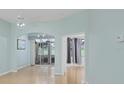 Bright living room featuring access to a sunroom at 2024 Lynx Run, North Port, FL 34288
