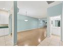 Spacious living room with light walls and laminate flooring at 2024 Lynx Run, North Port, FL 34288
