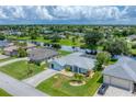 Aerial view of a residential neighborhood with houses and canals at 64 Long Meadow Ln, Rotonda West, FL 33947