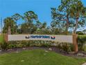 The entrance to Harbor Isles community features a well-maintained landscape and signage at 130 Nautical Dr, North Port, FL 34287
