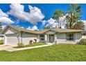 Newly renovated house, featuring a gray door and white exterior at 18142 Charter Ave, Port Charlotte, FL 33954