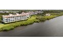 Beautiful waterfront condos offer stunning views of the bay, manicured lawns and lush mangrove shoreline at 11160 Hacienda Del Mar Blvd # D-205, Placida, FL 33946