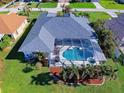 Home with a large screened-in pool and spacious backyard at 169 Medalist Rd, Rotonda West, FL 33947