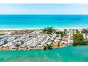 Aerial view of waterfront property with canal and beach access at 2375 N Beach Rd # 3B, Englewood, FL 34223