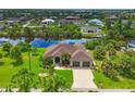 House with three-car garage and canal views at 15608 Lakeland Cir, Port Charlotte, FL 33981