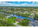 Waterfront property with canal access and surrounding homes at 15608 Lakeland Cir, Port Charlotte, FL 33981
