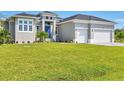 Single-story home with a two-car garage at 15715 Viscount Cir, Port Charlotte, FL 33981