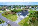 Aerial view of a house and neighborhood at 15715 Viscount Cir, Port Charlotte, FL 33981