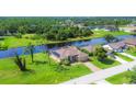 Single Gathering home on a canal with lush landscaping at 249 Rotonda Cir, Rotonda West, FL 33947
