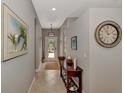 Bright and airy entryway with tile flooring and decorative accents at 3359 Osprey Ln, Port Charlotte, FL 33953