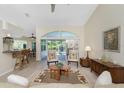 Bright living room with view to pool at 131 Broadmoor Ln, Rotonda West, FL 33947