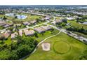 Bird's-eye view of house with golf course background at 8216 Parkside Dr, Englewood, FL 34224