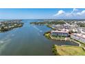 Aerial view of waterfront property, showcasing building and landscaping at 11100 Hacienda Del Mar Blvd # 202, Placida, FL 33946