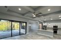 Open concept kitchen with island, stainless steel appliances, and breakfast bar at 13342 Commonwealth Ave, Port Charlotte, FL 33981