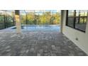Relaxing pool area with paver deck and screened enclosure at 13342 Commonwealth Ave, Port Charlotte, FL 33981