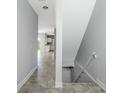 Interior entryway with tile floors and views into the living areas and stairs at 3923 Cape Haze Dr # 306, Rotonda West, FL 33947