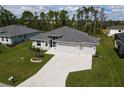 Single-Gathering home with two-car garage and landscaped yard at 14194 Wenzel Ave, Port Charlotte, FL 33981