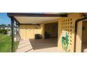 Back exterior showing covered patio area at 1700 Morning Dove Ln, Englewood, FL 34224