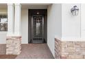 Front entry with stone accents and decorative screen door at 15033 Spanish Point Dr, Port Charlotte, FL 33981