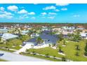 House with a large yard in a residential neighborhood at 13400 Buckett Cir, Port Charlotte, FL 33981