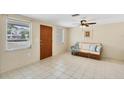 Bright living room with tile floors and comfy seating at 25 1St Ave, Englewood, FL 34223