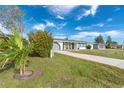 Well-maintained home with a lush landscape and spacious driveway at 20 Annapolis Ln, Rotonda West, FL 33947