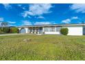 Front yard view of a single story home at 20 Annapolis Ln, Rotonda West, FL 33947