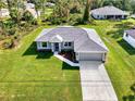 New construction home with a large backyard and driveway at 2775 Wyola Ave, North Port, FL 34286