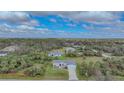 Aerial view of single-story home with surrounding landscape at 19196 Raymond Ave, Port Charlotte, FL 33954