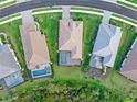 Aerial view of houses with pools in a community at 10985 Trevino St, Englewood, FL 34223