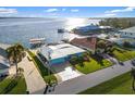 Aerial view of waterfront home with private dock and boat lift at 12596 Bacchus Rd, Port Charlotte, FL 33981