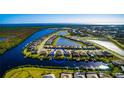 Aerial view of home, neighborhood, and community waterways and natural surroundings at 15048 Spanish Point Dr, Port Charlotte, FL 33981