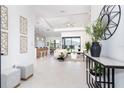 Open concept foyer with view of living room and kitchen at 12004 Newgate Ave, Port Charlotte, FL 33981