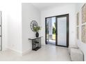 Bright foyer with contemporary decor and access to the living areas at 12004 Newgate Ave, Port Charlotte, FL 33981