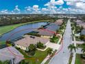 Aerial view of single-story home with pool and golf course nearby at 5100 White Ibis Dr, North Port, FL 34287