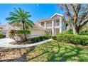 Two-story condo with balcony and lush landscaping at 3113 Club Dr # 118, Port Charlotte, FL 33953