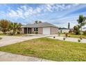 Newly built home with a spacious yard and driveway at 19483 Midway Blvd, Port Charlotte, FL 33948