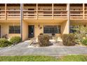 Condo building exterior with individual unit entrances at 23 Quails Run Blvd # 2, Englewood, FL 34223