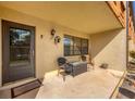 Front porch with seating area and entrance to condo unit at 23 Quails Run Blvd # 2, Englewood, FL 34223