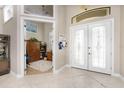 Bright and spacious entryway with office and double doors at 230 Long Meadow Ln, Rotonda West, FL 33947