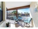 Private balcony with seating area and scenic views at 404 Pine Hollow Cir # 404, Englewood, FL 34223